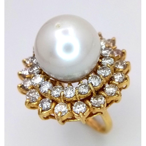 12 - A stunning 18 K yellow gold ring with a large perfectly spherical white natural pearl, 14 mm in diam... 