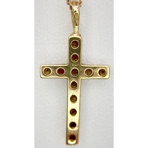 539 - Classic 9 carat GOLD CROSS set with RUBIES and mounted on a 9 carat fine GOLD CHAIN. Cross x 2.5 cm ... 