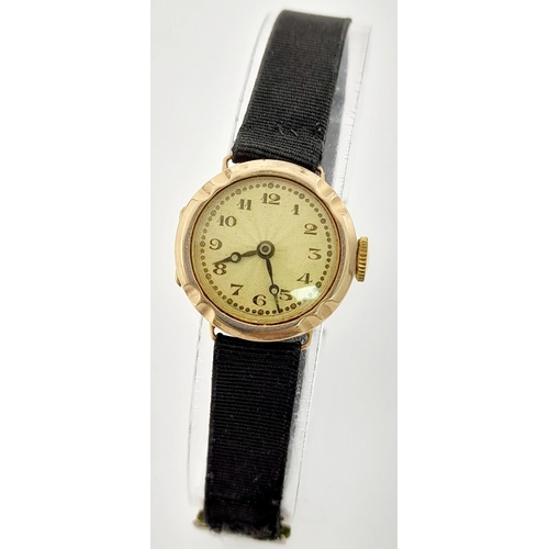 563 - A Vintage 15 Jewels Mechanical 9K Gold Cased Ladies Watch. Black textile strap. 9k gold case -21mm. ... 