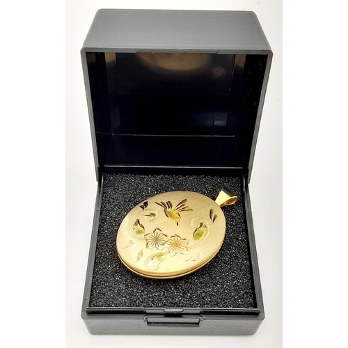 602 - Beautifully decorated 14 carat GOLD FILLED OVAL LOCKET. Opens and closes perfectly. Condition new an... 