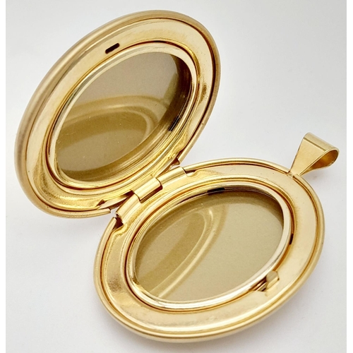 602 - Beautifully decorated 14 carat GOLD FILLED OVAL LOCKET. Opens and closes perfectly. Condition new an... 