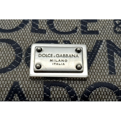 618 - A Dolce and Gabbana Small Leather and Textile Wallet. 9.5cm x 7cm.