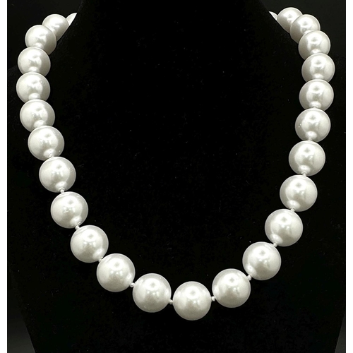 779 - A Bright White South Sea Pearl Shell Large Bead Necklace. 14mm beads. 42cm necklace length.