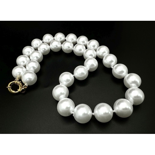 779 - A Bright White South Sea Pearl Shell Large Bead Necklace. 14mm beads. 42cm necklace length.