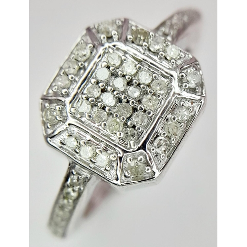 916 - A STERLING SILVER DIAMOND SET CLSUTER RING. 3.28G IN WEIGHT. SIZE N AND 1/2. Ref: 8785