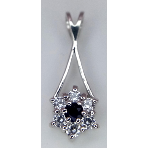 987 - A 18K WHITE GOLD STONE SET DROP PENDANT. 1.45G IN WEIGHT. APPROX 2CM IN LENGTH. Ref: SC 5025.