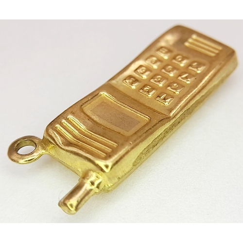 1190 - A 9K YELLOW GOLD MOBILE PHONE CHARM. 0.7G IN WEIGHT. 2CM IN LENGTH. Ref: SC 5013.