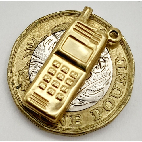 1190 - A 9K YELLOW GOLD MOBILE PHONE CHARM. 0.7G IN WEIGHT. 2CM IN LENGTH. Ref: SC 5013.