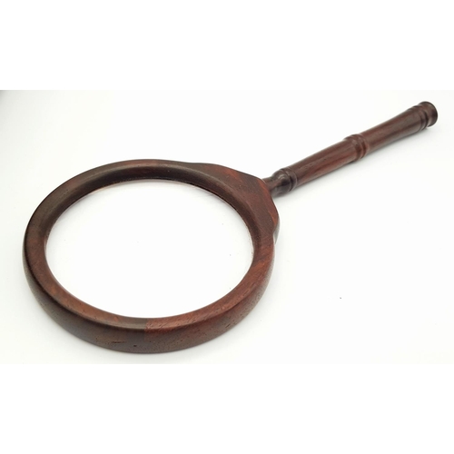 633 - A Wonderfully Constructed Chinese Wooden Magnifying Glass. Comes with a decorative fitted wooden cas... 