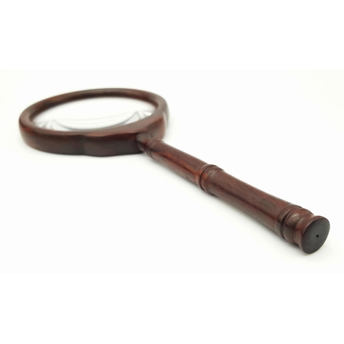 633 - A Wonderfully Constructed Chinese Wooden Magnifying Glass. Comes with a decorative fitted wooden cas... 