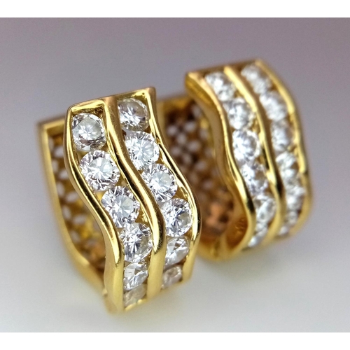 603 - A Pair of 18K Yellow Gold, 2.4ctw Diamond, Oval Earrings. Pierced decoration with each earring havin... 