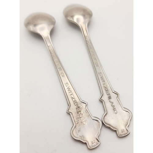 843 - A pair of small metal teaspoons made for Bucherer of Lucerne Switzerland. 11cm in length. See photos... 