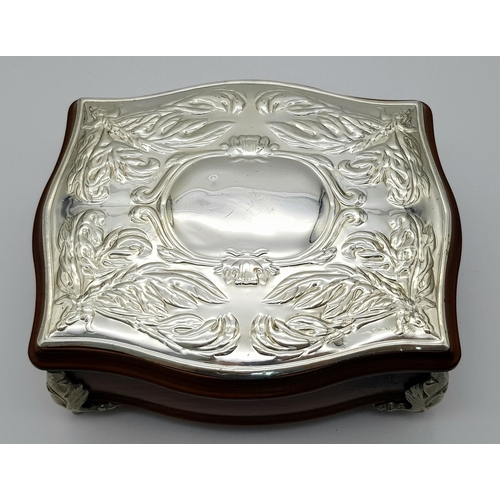 604 - A Silver Lidded Jewellery Box. 18 x 16cm.