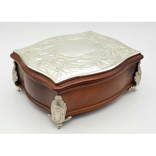 604 - A Silver Lidded Jewellery Box. 18 x 16cm.