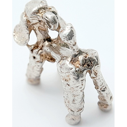 1064 - A STERLING SILVER POODLE DOG CHARM. 4.6G IN WEIGHT. Ref: 8772.