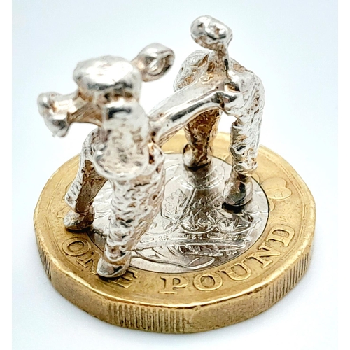 1064 - A STERLING SILVER POODLE DOG CHARM. 4.6G IN WEIGHT. Ref: 8772.