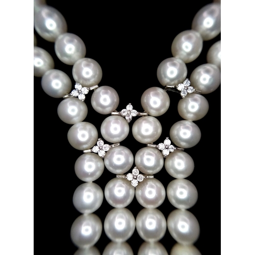 520 - A fabulous two string top quality pearl necklace with cubic zirconia connectors. 8 mm white spherica... 