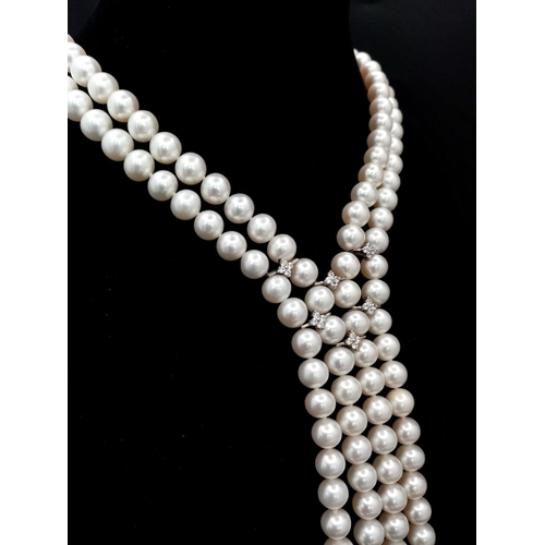 520 - A fabulous two string top quality pearl necklace with cubic zirconia connectors. 8 mm white spherica... 