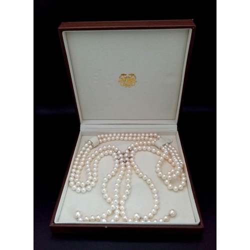 520 - A fabulous two string top quality pearl necklace with cubic zirconia connectors. 8 mm white spherica... 