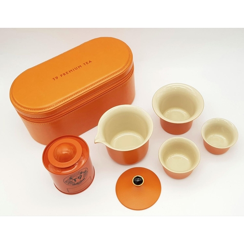 611 - A Portable Kung Fu T9 Ceramic Tea Set - Includes tea caddy, tea pot, large cup and two drinking cups... 