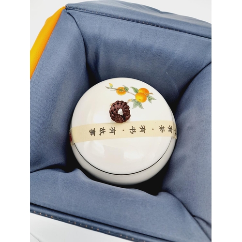 830 - A Beautiful Japanese Tea Caddy with Fruit and Bird Decoration. As new, 11cm tall. Comes with its own... 