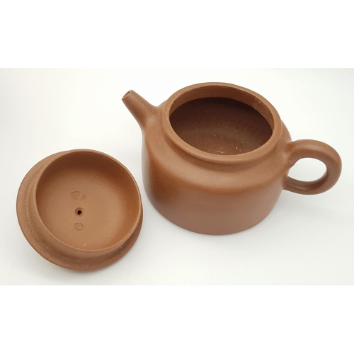 920 - A Quaint Chinese Terracotta Teapot. With two pieces of decorative packaging. As new. 7cm tall. Ref: ... 