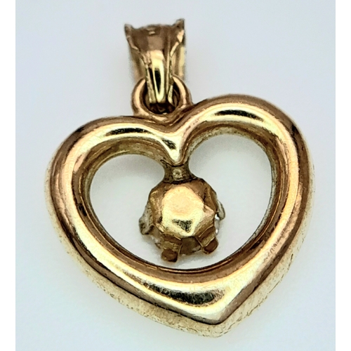 988 - A 9K Yellow Gold White Stone Heart Pendant. 15mm. 0.45g