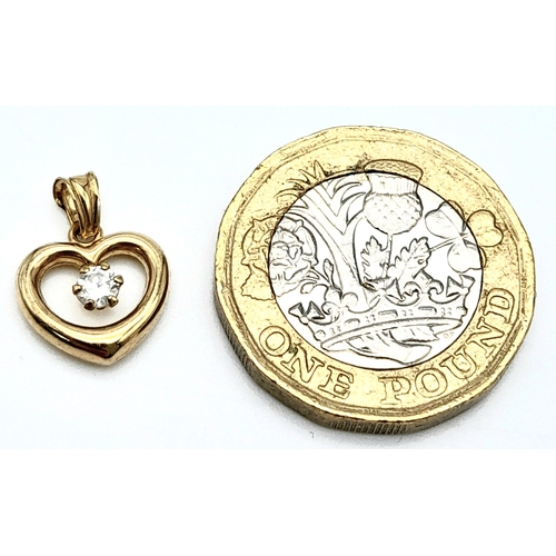 988 - A 9K Yellow Gold White Stone Heart Pendant. 15mm. 0.45g