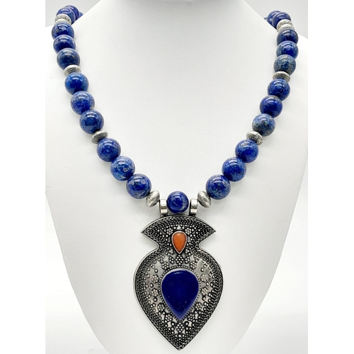 1025 - A Lapis Lazuli Jewellery Suite: Cuff bangle, necklace and earrings. 48cm length.