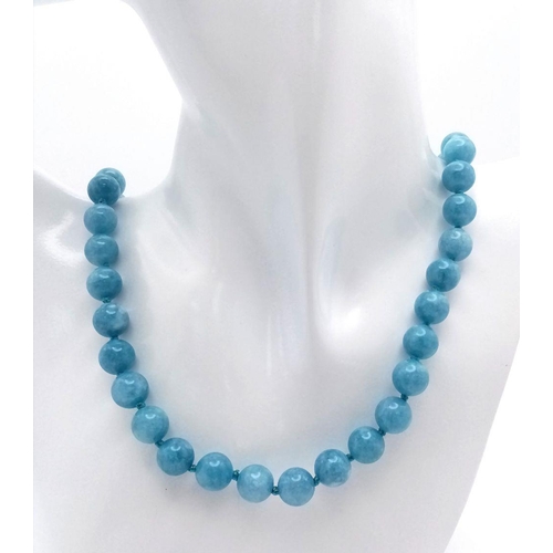 997 - A Natural Aquamarine Water Pattern Beaded Matinee Length Necklace. 90cm necklace length. 10mm beads.