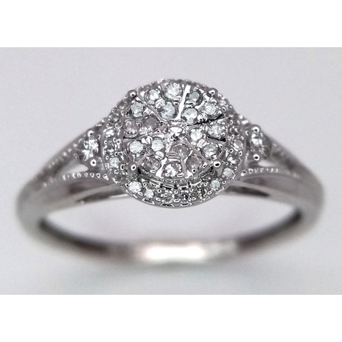 1001 - A 9K WHITE GOLD DIAMOND RING. 0.15CT. 1.75G IN WEIGHT. SIZE K AND 1/2. Ref: 8690.