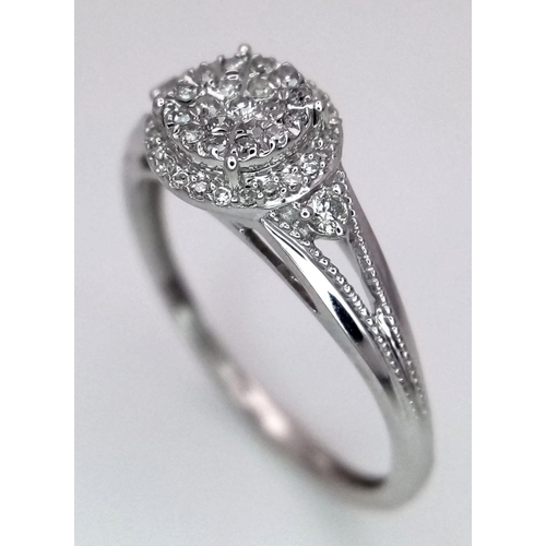 1001 - A 9K WHITE GOLD DIAMOND RING. 0.15CT. 1.75G IN WEIGHT. SIZE K AND 1/2. Ref: 8690.