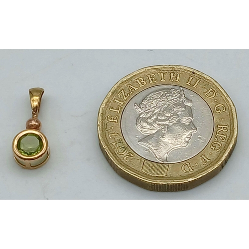 1015 - A 9K YELLOW GOLD PERIDOT SET PENDANT. 0.4G IN WEIGHT. Ref: SC 5059.