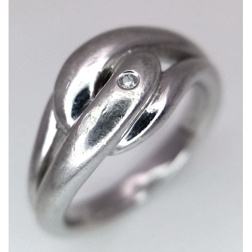 1036 - STERLING SILVER DIAMOND SET KNOT RING. 6.2G IN WEIGHT. SIZE N. Ref: 8781.