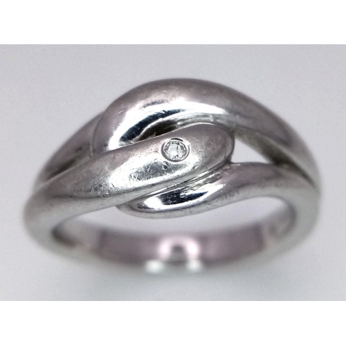 1036 - STERLING SILVER DIAMOND SET KNOT RING. 6.2G IN WEIGHT. SIZE N. Ref: 8781.