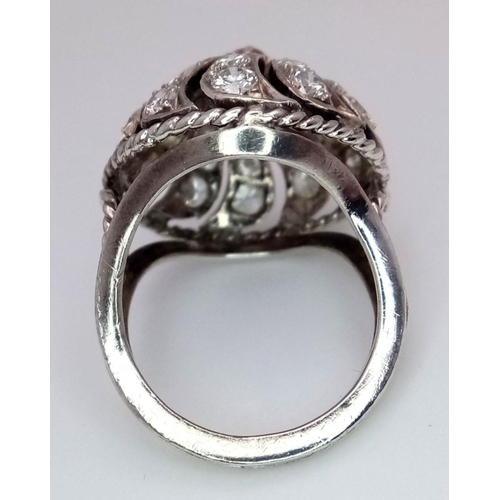 1057 - A STERLING SILVER STONE SET SWIRL RING. 4.6G IN WEIGHT. SIZE I AND 1/2. Ref: 8771.