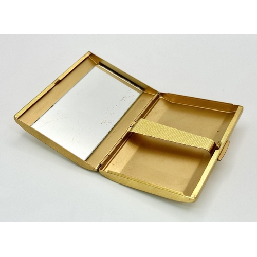 885 - A beautiful vintage gold plated cigarette case with a Mother of Pearl lid and fancy engraving. Hinge... 