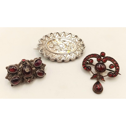 897 - Three vintage brooches with different styles, one ART NOUVEAU with red stones, one engraved sterling... 