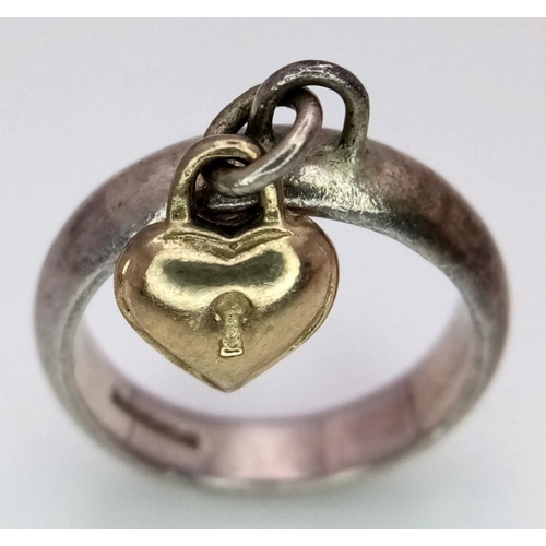 926 - A Vintage Silver Ring With a Hanging Gold (tests as 9k) Charm. Size H.