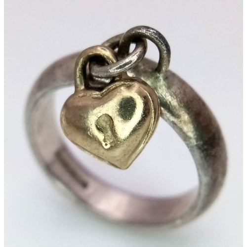 926 - A Vintage Silver Ring With a Hanging Gold (tests as 9k) Charm. Size H.