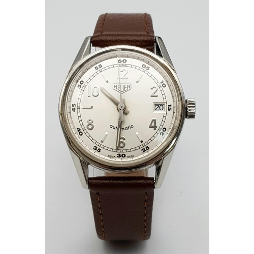 983 - A Tag Heuer Automatic Gents Watch. Brown leather strap. Stainless steel case - 36mm. Silver tone dia... 