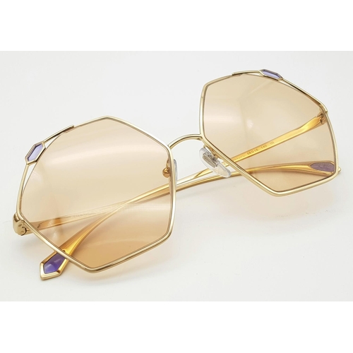 1034 - A Pair of Designer Ladies Bulgari Sunglasses. Hexagonal shape. Good condition. Box and case.