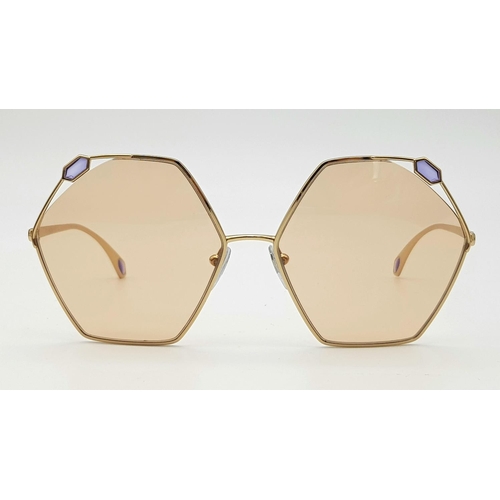 1034 - A Pair of Designer Ladies Bulgari Sunglasses. Hexagonal shape. Good condition. Box and case.