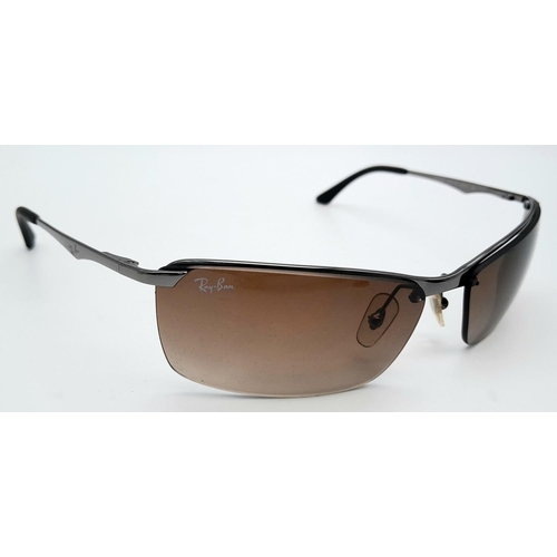 1076 - A Pair of Ray Ban Sunglasses - With case that needs restitching.