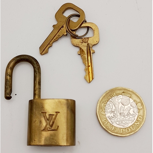 1055 - A Louis Vuitton Small Travel Padlock and Two Keys. 3.5cm.