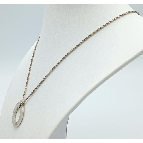 1039 - A sterling silver TIFFANY & CO rope chain necklace with signed round pendant. Chain length: 60 cm, p... 