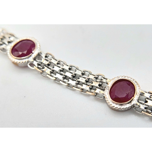 1134 - A 18K WHITE GOLD RUBY SET BRACELET. 5.1G IN WEIGHT. Ref: SC 5078.