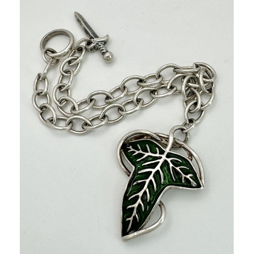 1154 - A Very Unique American Sterling Silver Charm T- Bar Style Bracelet with Enamel Leaf and Dagger Charm... 