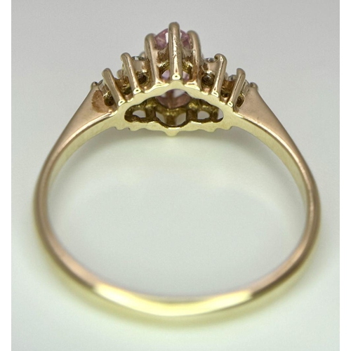 600 - A 9K YELLOW GOLD STONE SET RING - 2.1G. SIZE N. REF: CHIN 5001