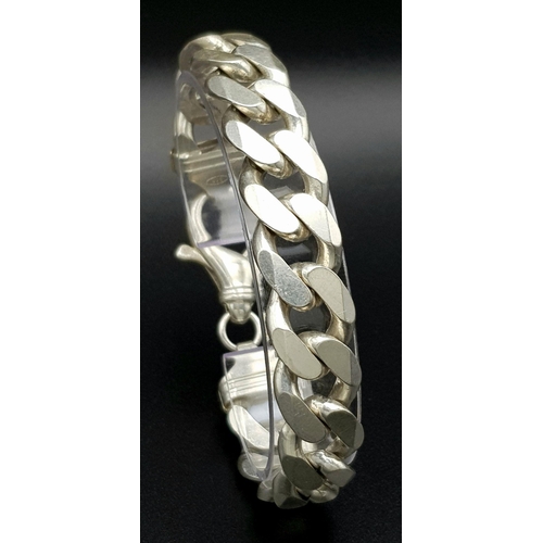 653 - A Chunky Stylish Solid Silver 925 Curb Chain Bracelet, 64.5 grams, 21.5cm. Signs of wear but In very... 